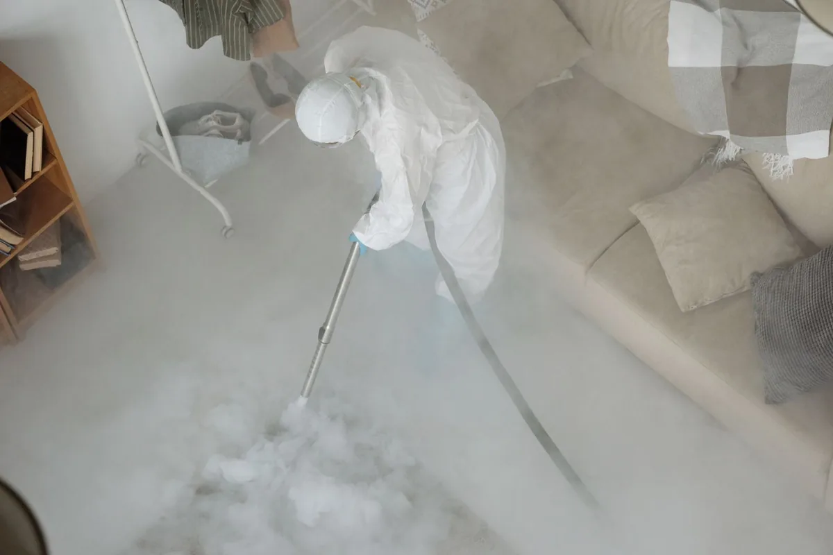 Biohazard cleanup technician in protective equipment, Exton, PA
